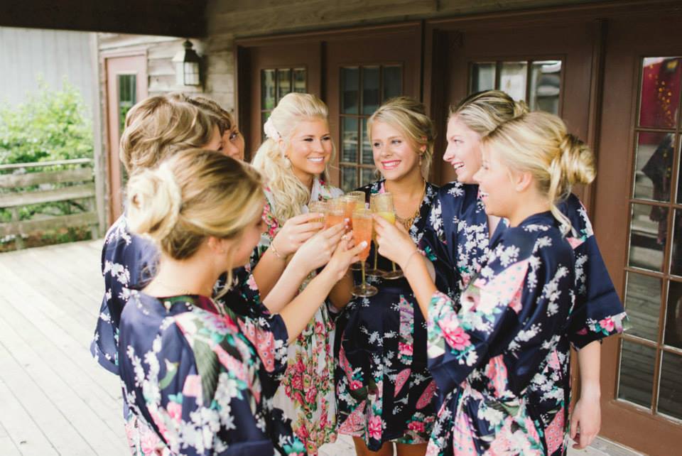 Bride__bridesmaids_champagne_toast_in_floral_robes_Jeff_Loves_Jessica_Photography_Aamodts_Apple_Farm