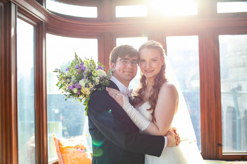 bride and groom smiling