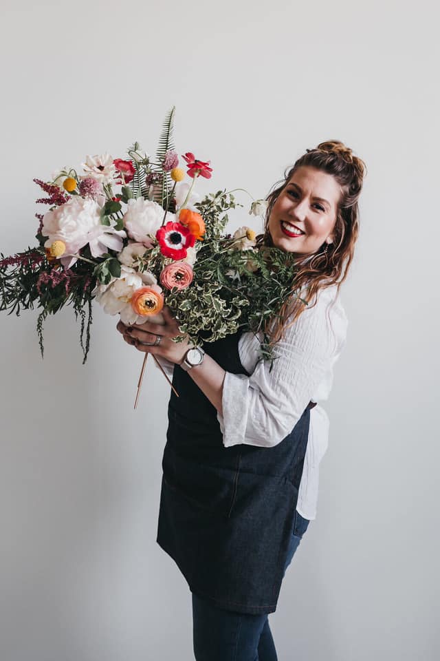 woman holding large bouquet 