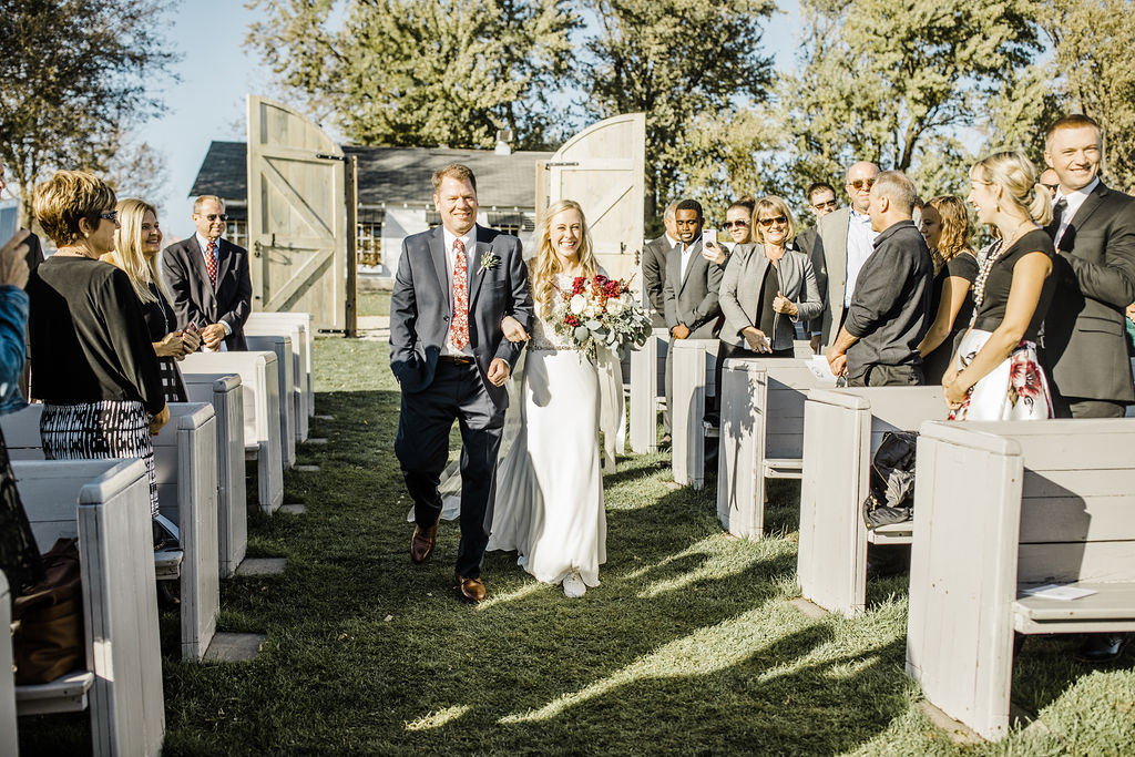 Father walking bride down aisle