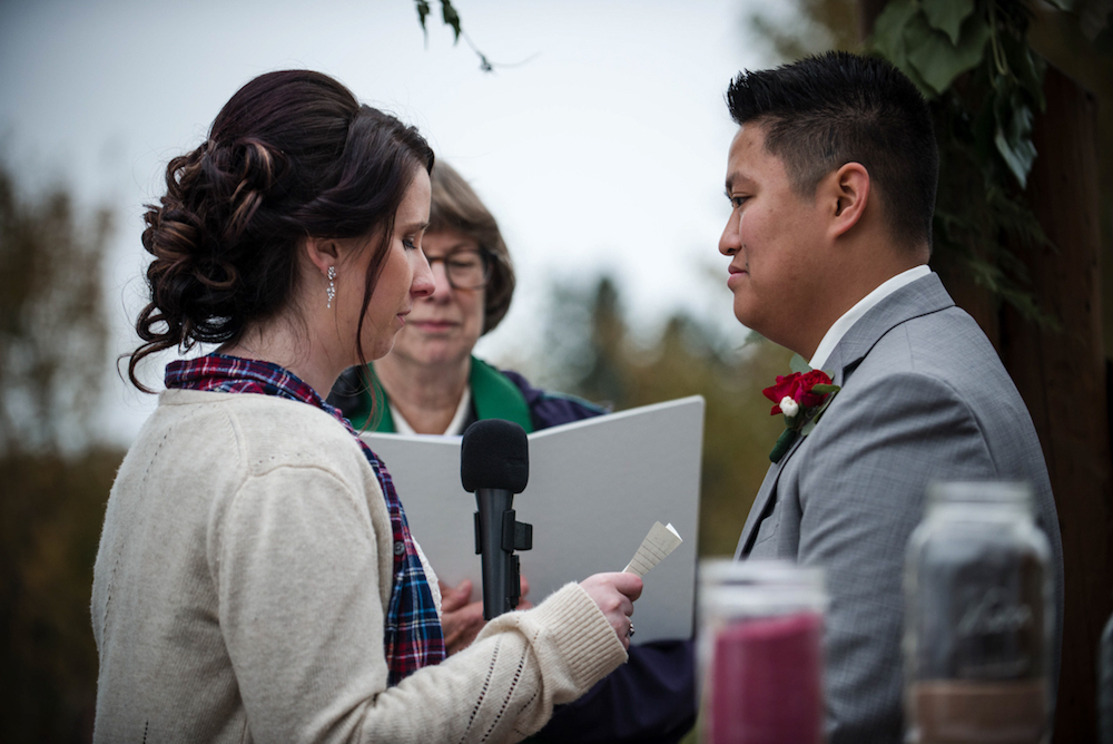 bride and groom exchanging vows