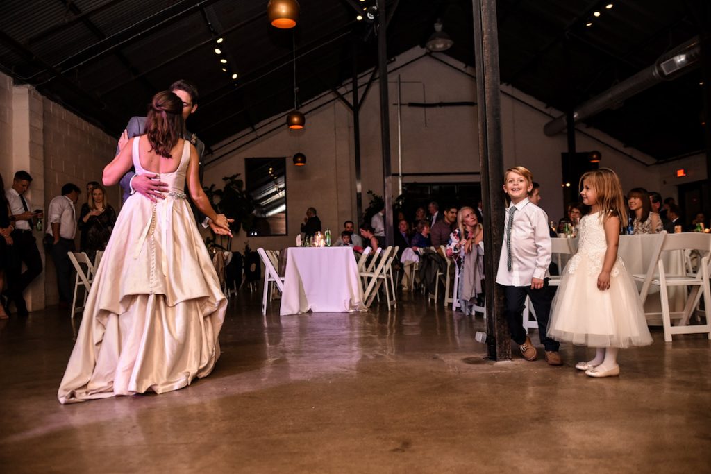 couples first dance with flower girl and ring bearer
