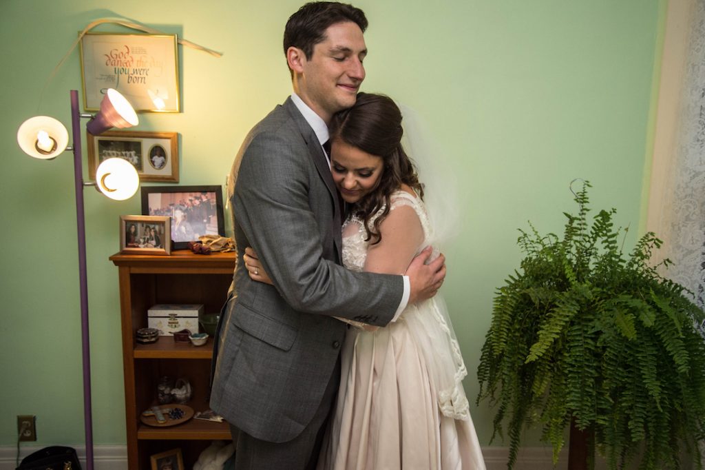 bride and groom hugging