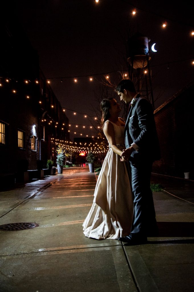 outside first dance with cafe lights