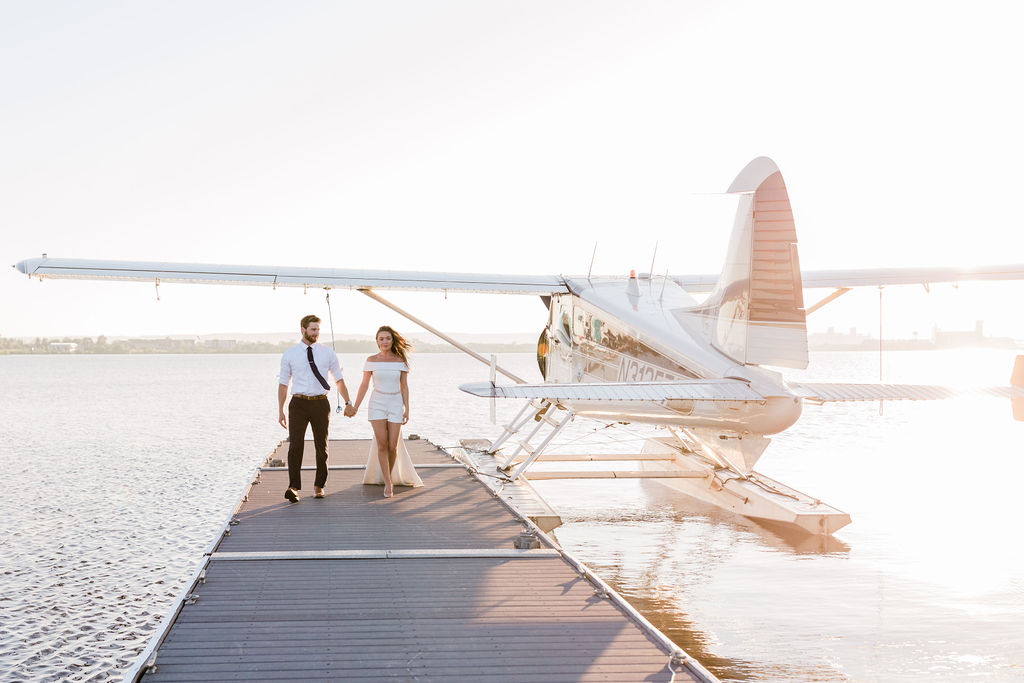 bride and groom walking away from small plane