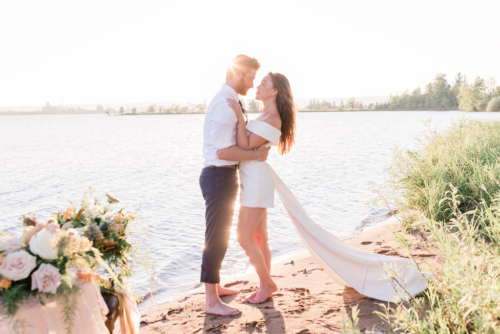 bride and groom embracing 