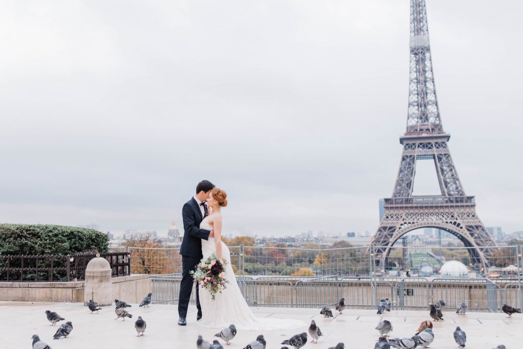 couple in front of the eiffel tower 