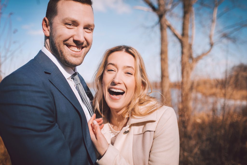 bride and groom laughing 