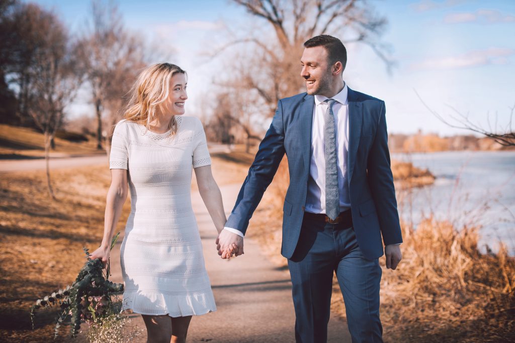 bride and groom walking and holding hands