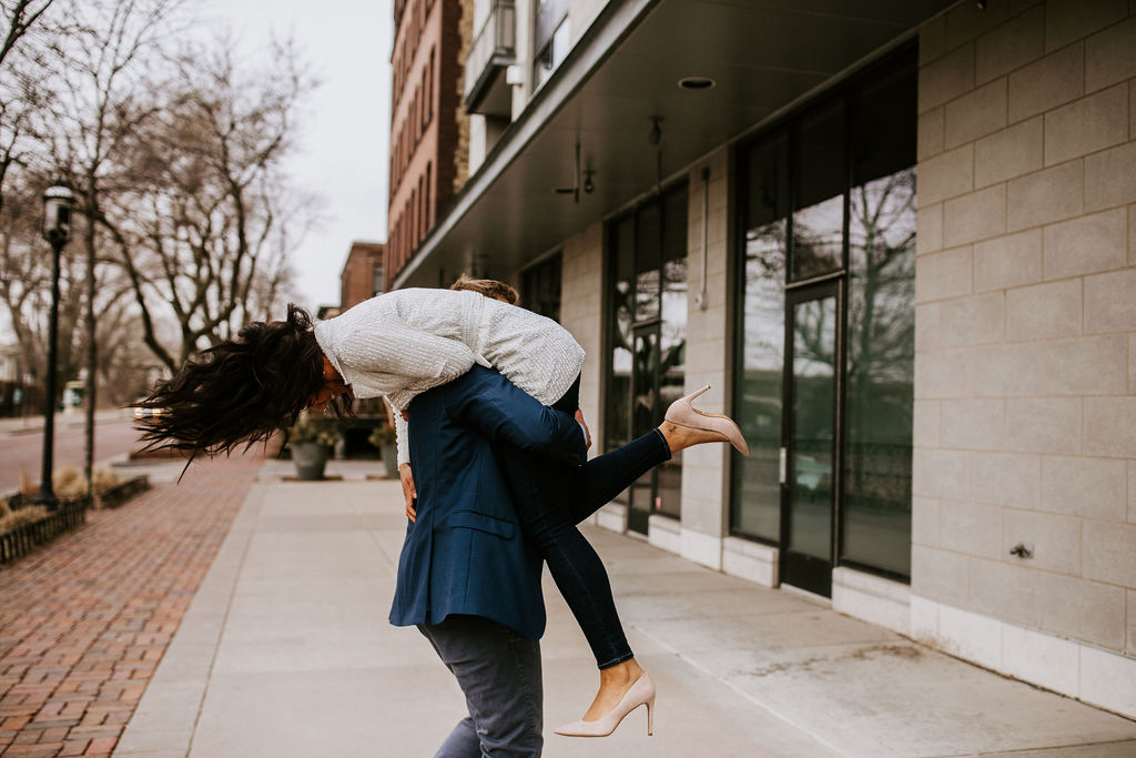 groom picking bride up