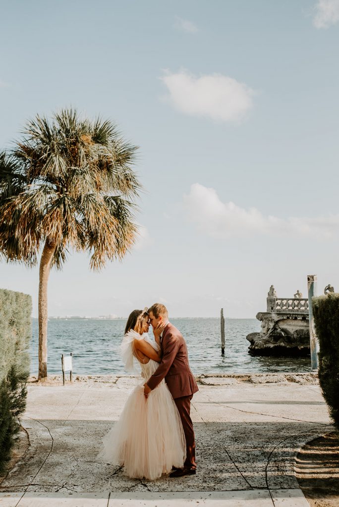 Bride and groom kissing at Miami wedding