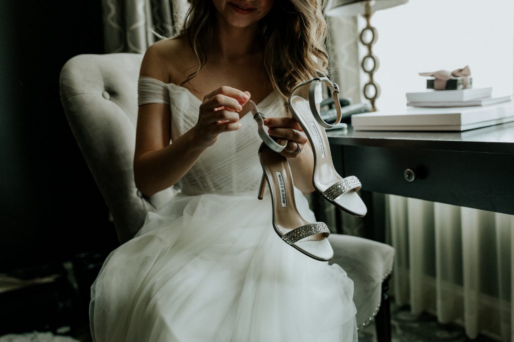 bride putting on shoes