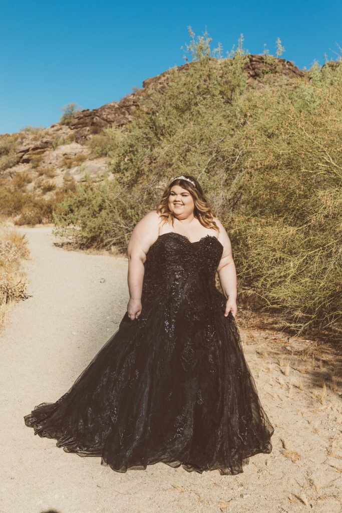 bride in black wedding dress in desert