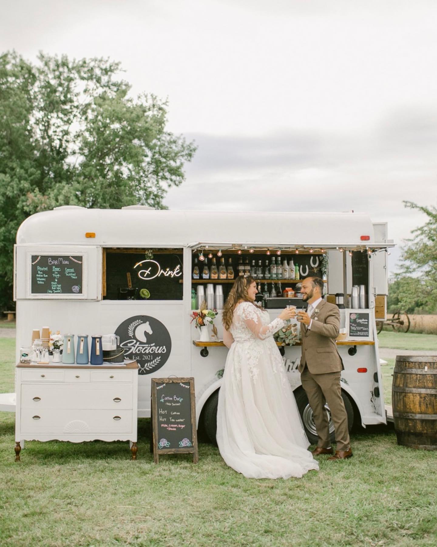 bride and groom at mobile bar