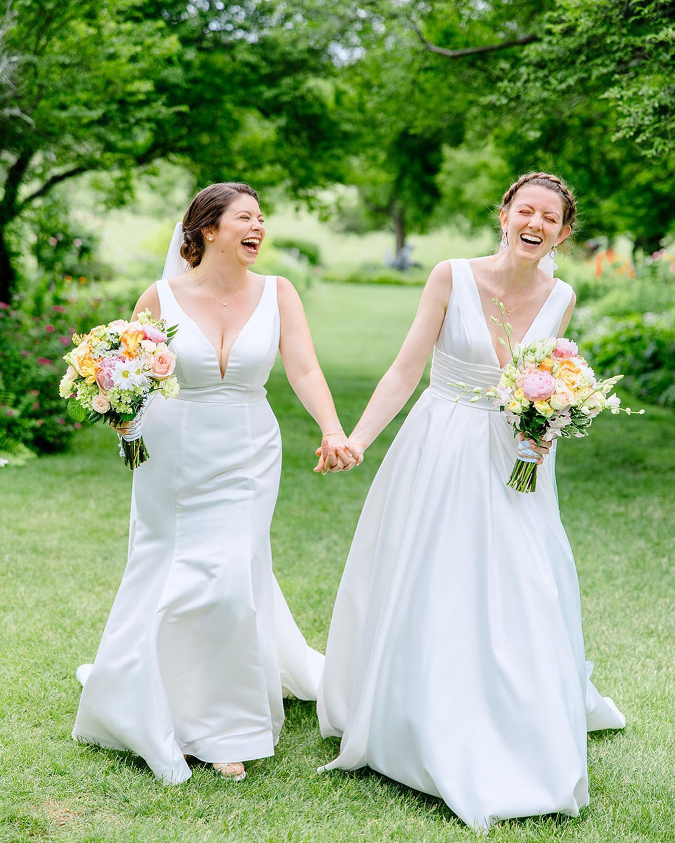brides walking happily laughing 
