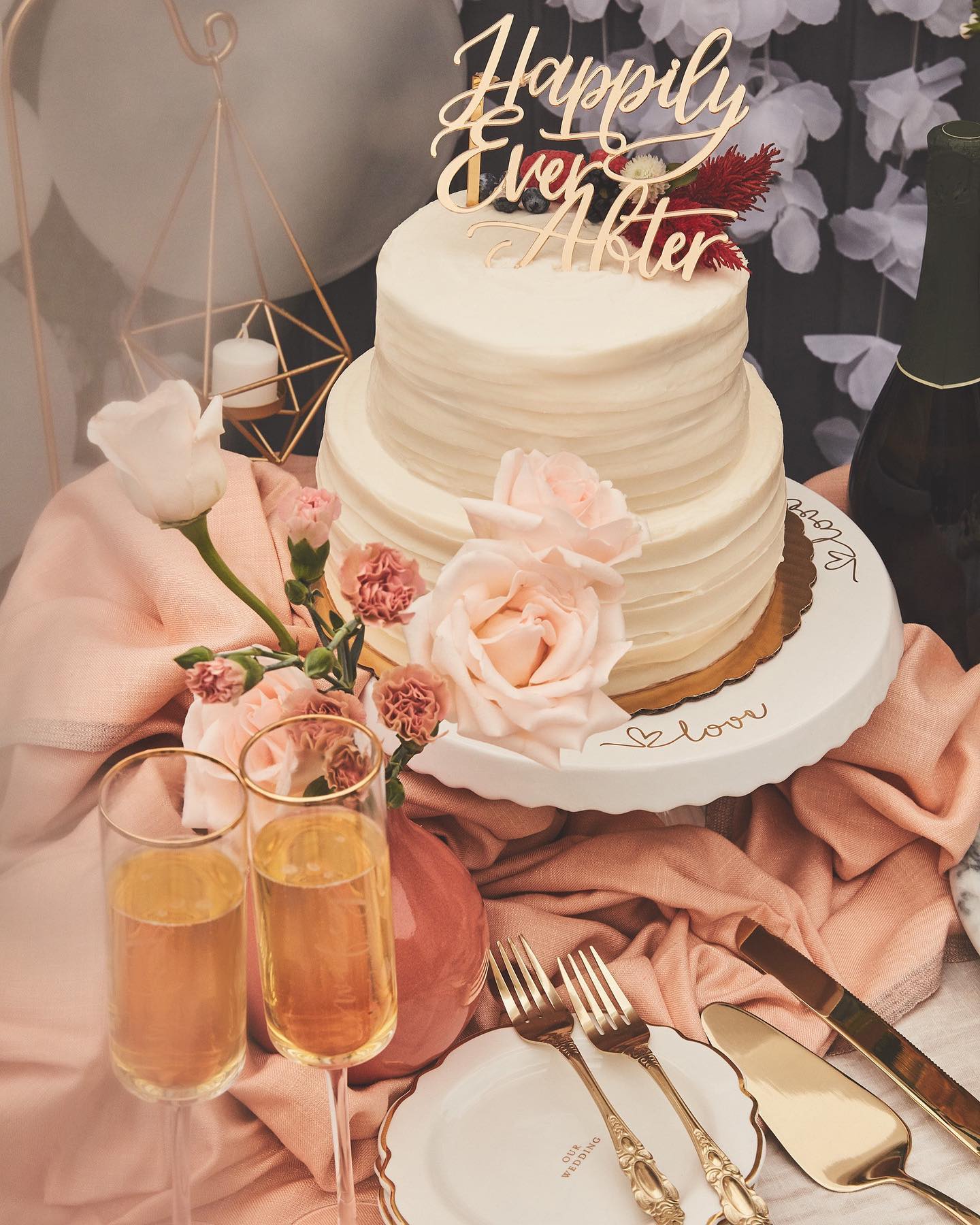wedding cakes, champagne flutes, and dessert table setup