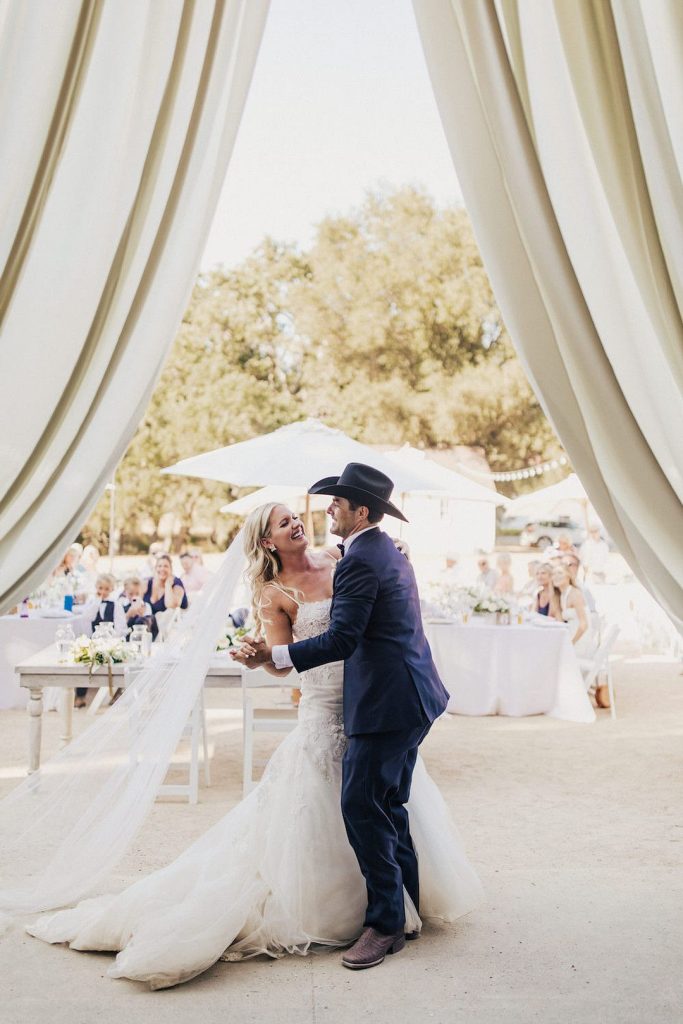 bride and groom dancing outdoors