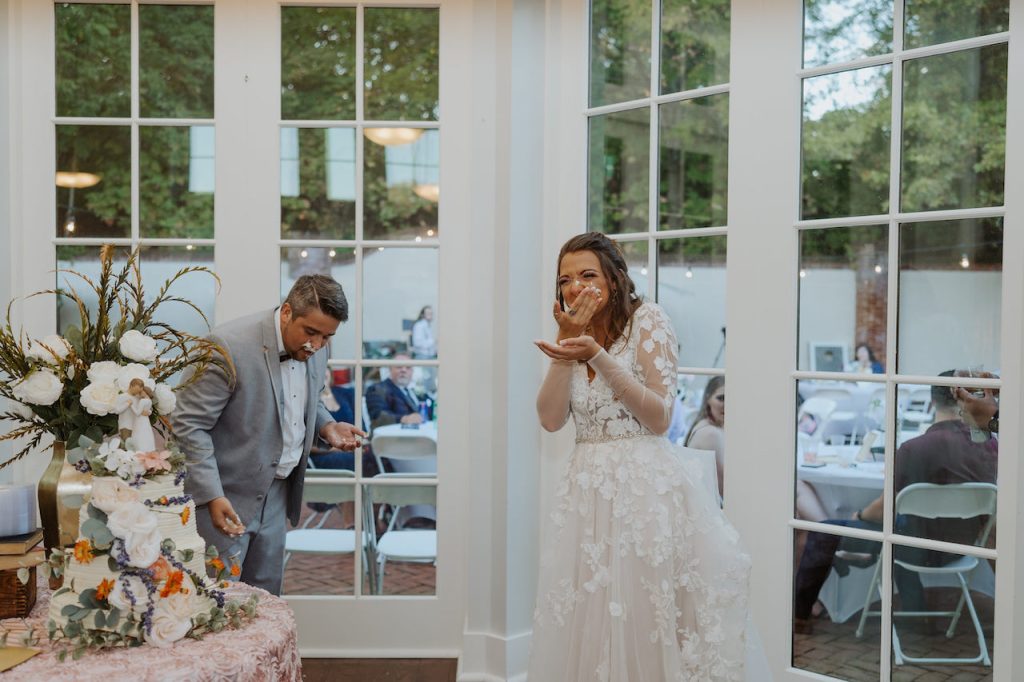bride and groom cutting cake - outdoor wedding in tennessee