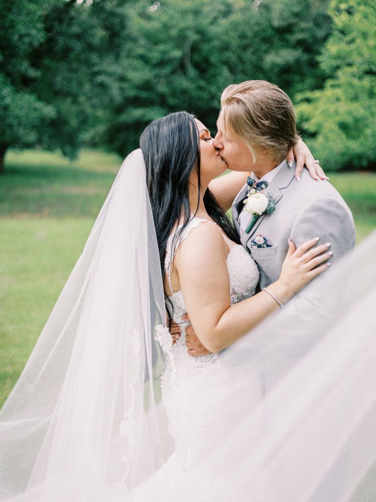 bride and groom at romantic barn wedding in Texas