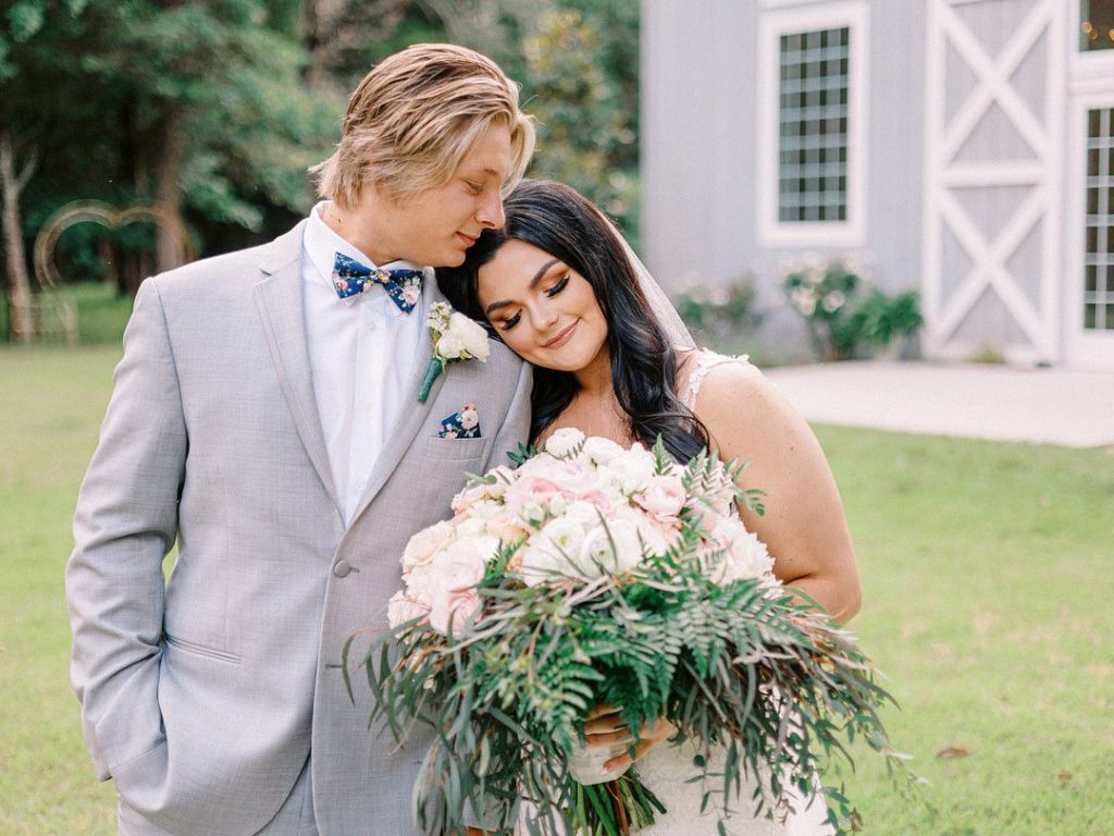 bride and groom at romantic barn wedding in Texas