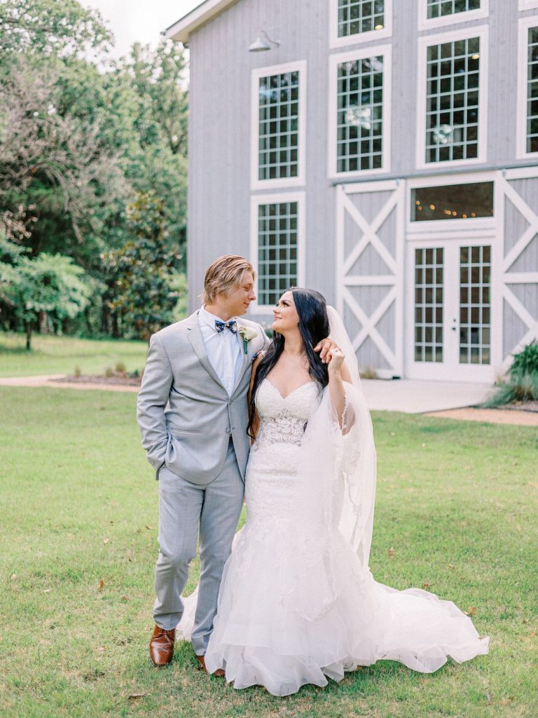 bride and groom in romantic barn wedding in Texas