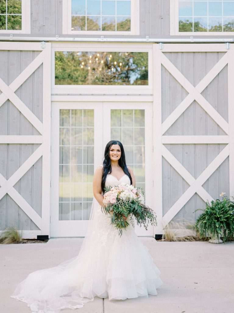 bride at romantic barn wedding in Texas