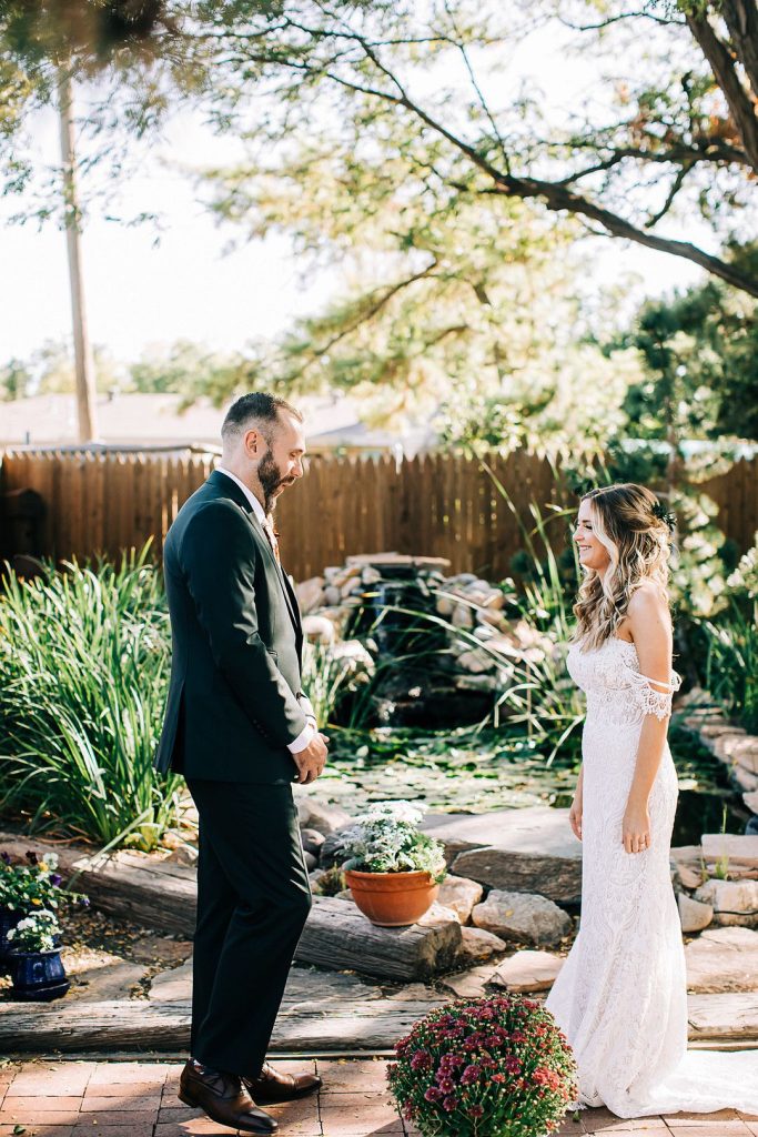 bride and groom first look backyard wedding in texas