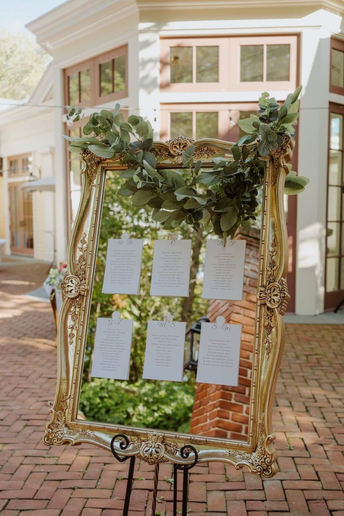 antique mirror wedding seating chart display