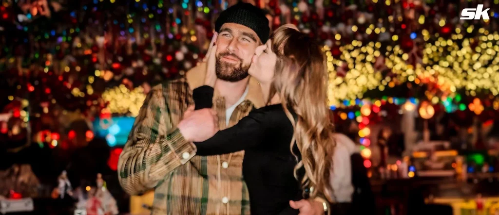 Taylor Swift and Travis Kelce at a Christmas celebration