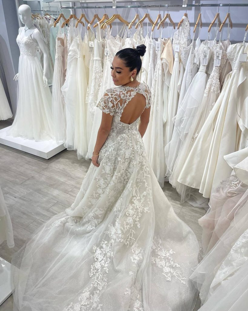 A bride trying on wedding dresses at her David's Bridal wedding dress appointment