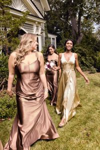 Women in champagne bridesmaid dresses